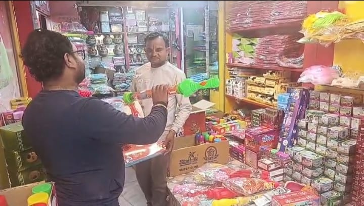 Market decorated with colours and gulal and water guns
