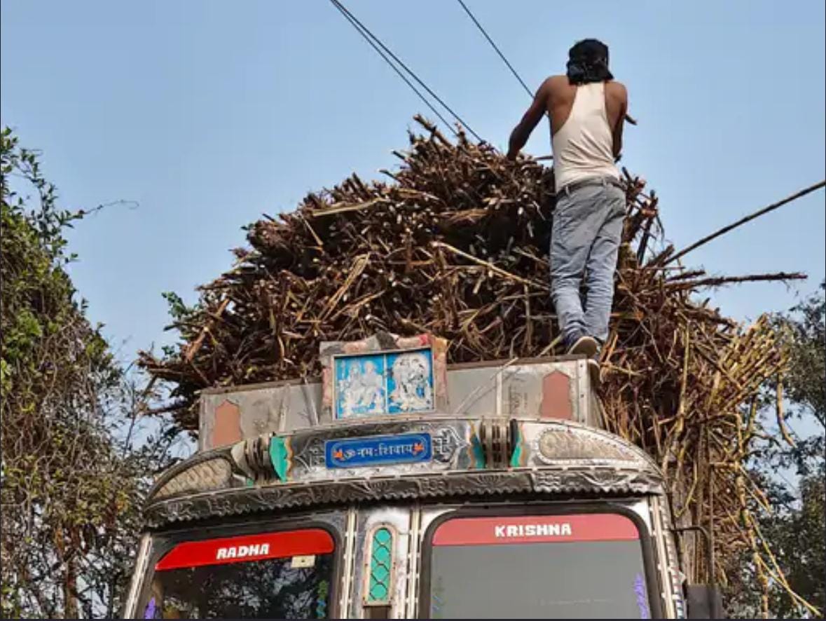 Sugarcane laden truck stuck in high tension wire