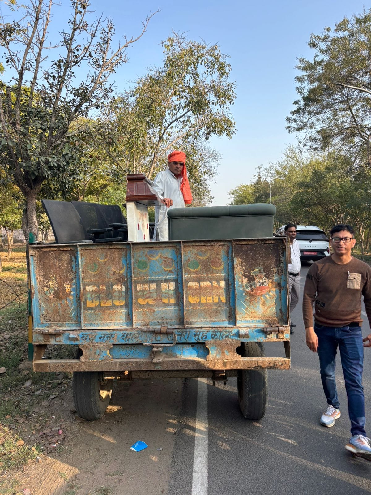 Tractor-trolley carrying belongings of former SDO of MDU stopped