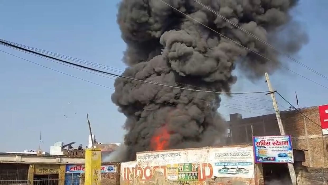A spark from breaking a gas lighter set a junk shop on fire, injuring seven people.