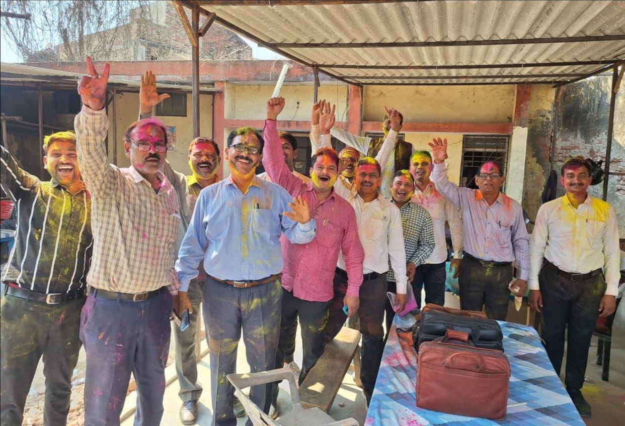 Wishing each other Happy Holi by applying Abir Gulal