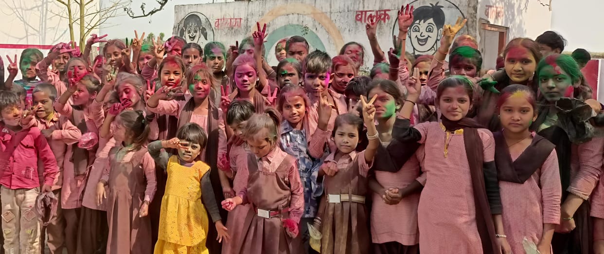 Children created a ruckus by playing with colours and abir-gulal