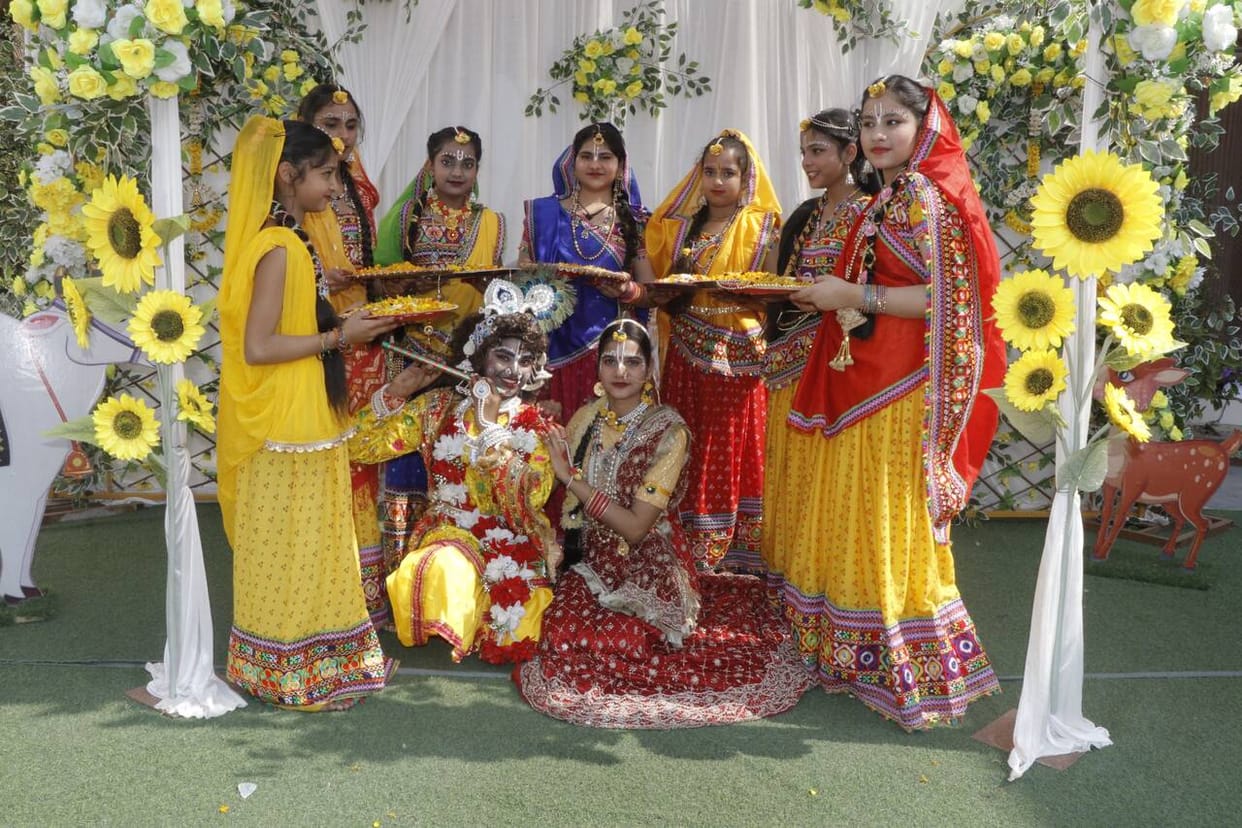 People danced to Holi songs, showered colors and flowers