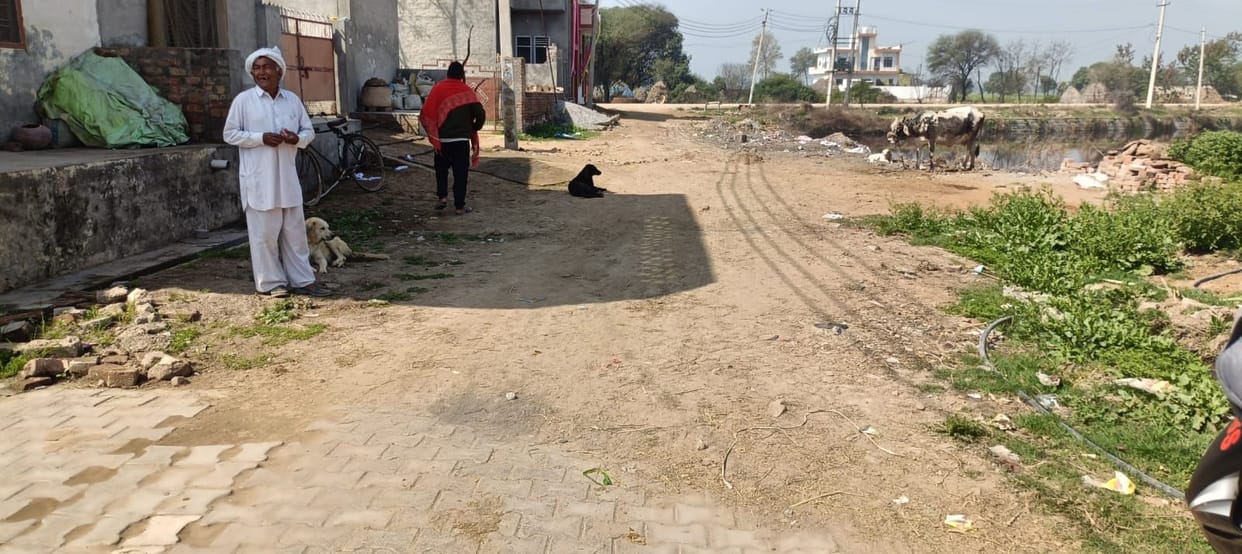 The dilapidated street exposes the claims of development