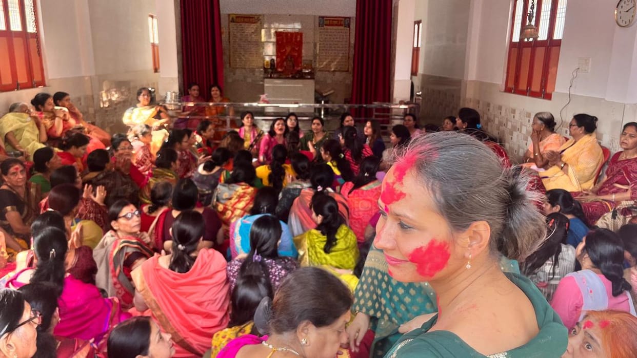 Women danced to devotional songs and played Holi with gulal.