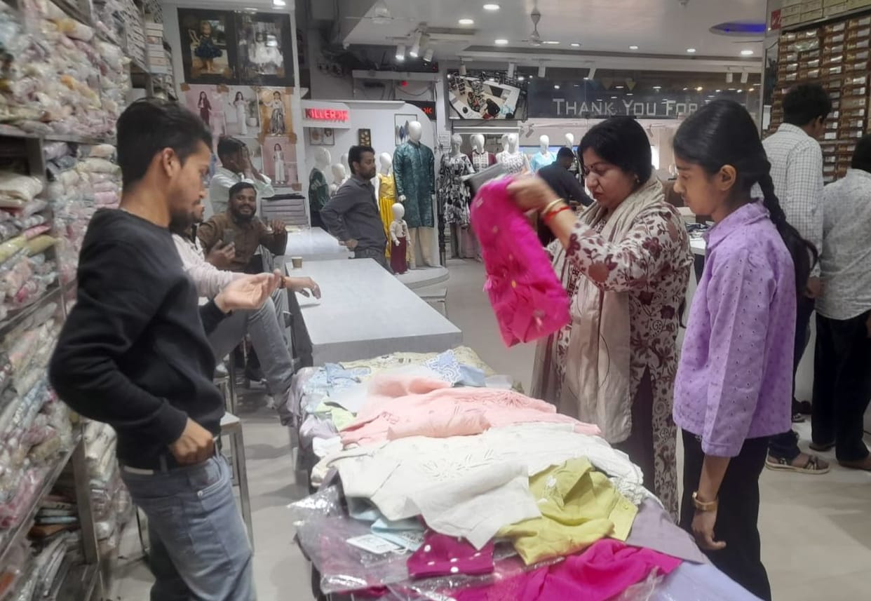 Gujhiya, Namkeen, clothes galore...market painted in the colors of Holi