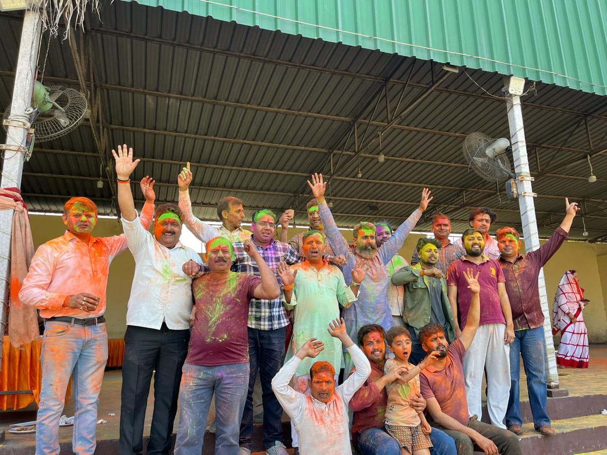 Abir-gulal was thrown at the Holi Milan ceremony.