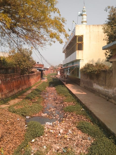 The fasting people are very upset due to the drain not being cleaned on the mosque road.