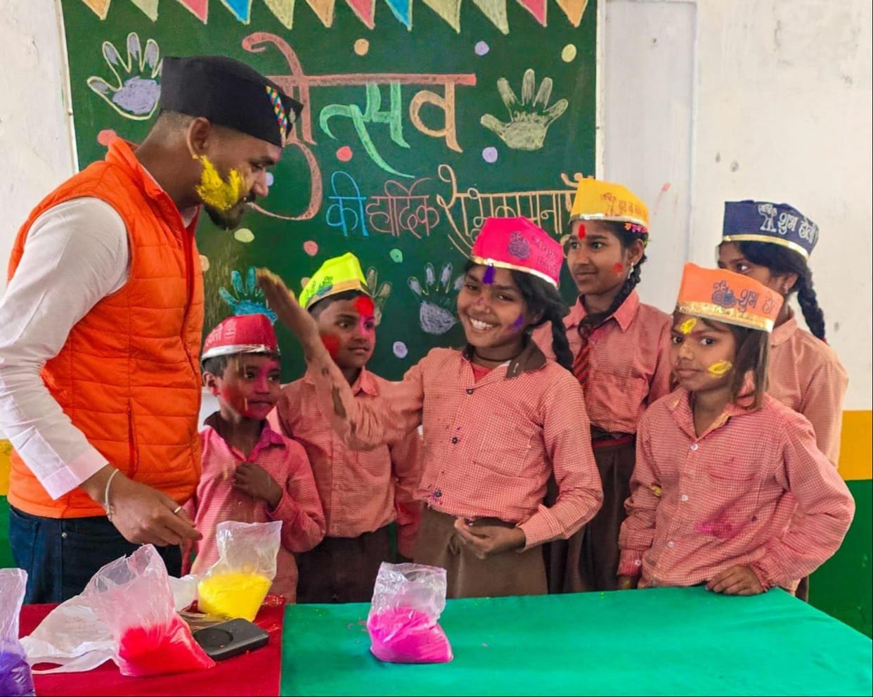 Along with the teachers, the children also threw gulal.