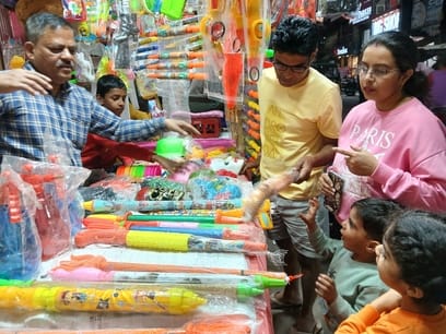 Holi celebrations engulf the market, with the fragrance of colours