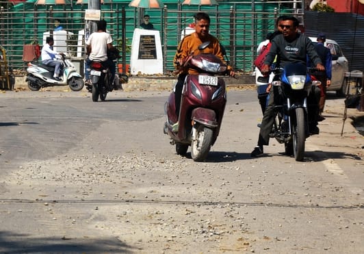 Potholes filled with soil and gravel after spending lakhs...danger of vehicle slipping
