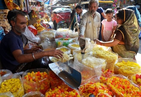 Abir-gulal and readymade clothes shops are buzzing