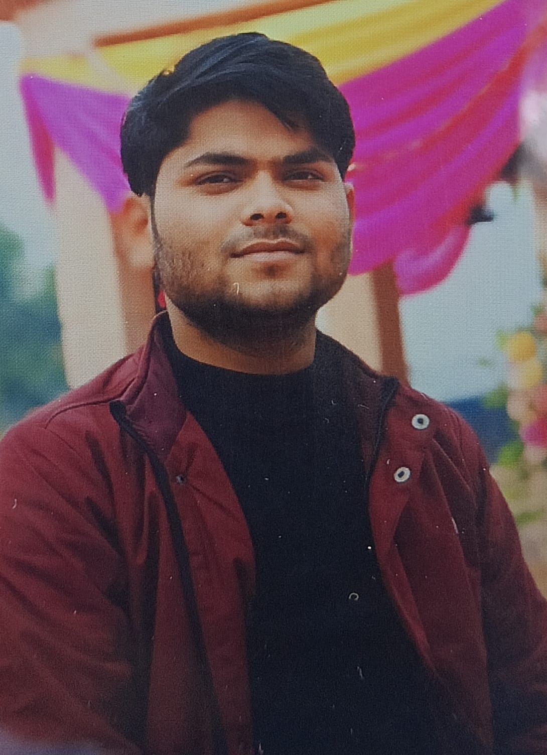 The body of a young man was found hanging at his brother's friend's house.