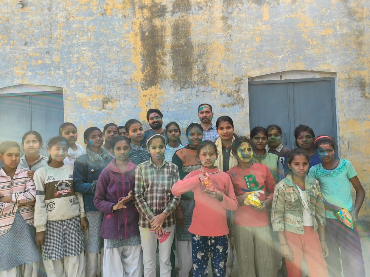 Students and teachers celebrated Holi Milan ceremony.