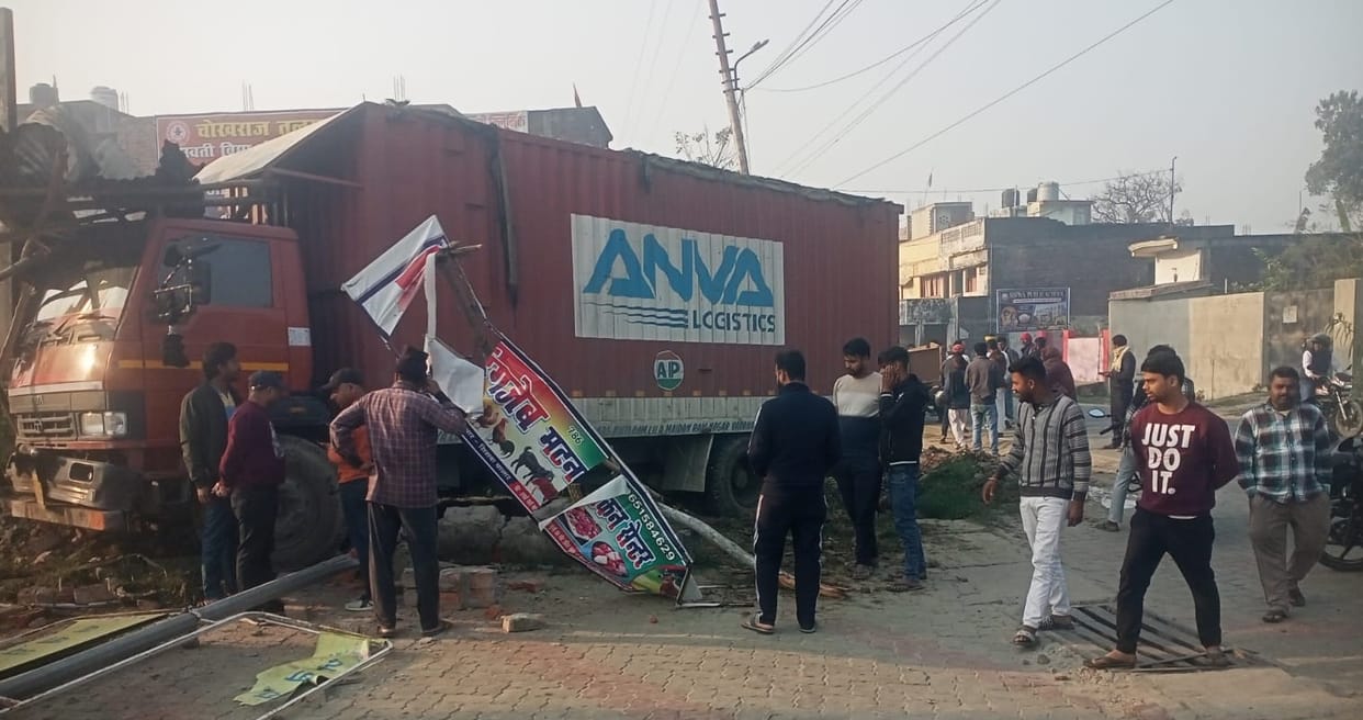 Due to tyre burst, an uncontrolled truck hit a trolley and collided with a wall.