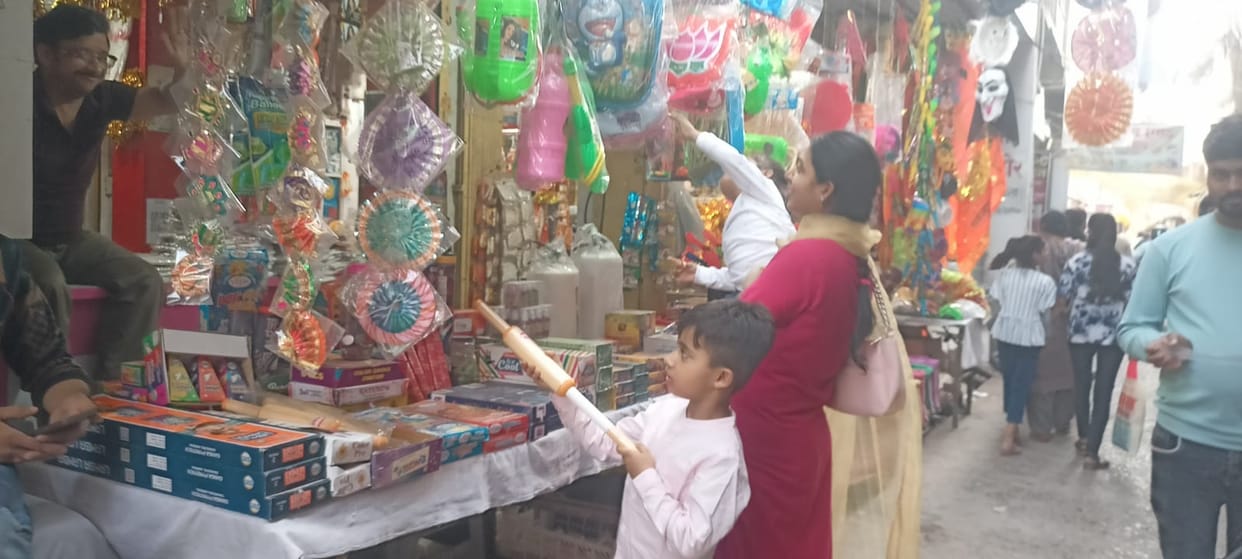 Pichkari with mask and mace is liked by children