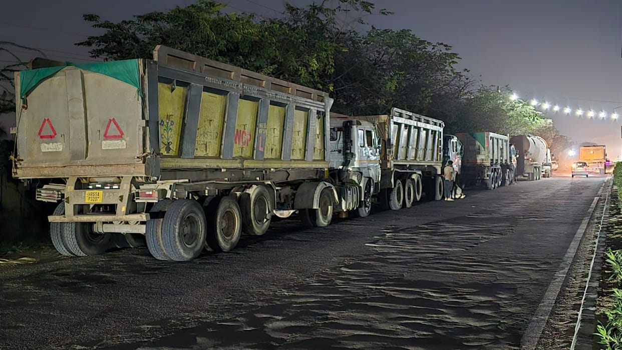 Large vehicles parked on the roads pose a danger, forcing people to travel in the dark.