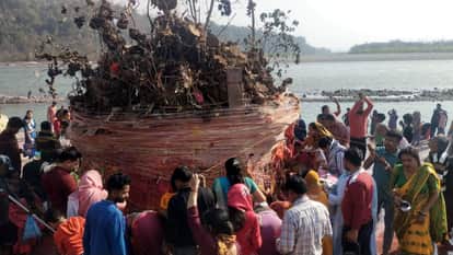 People gathered at Triveni Ghat for Holika Puja.