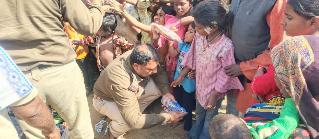 Julana police station in-charge distributed shoes to the needy.