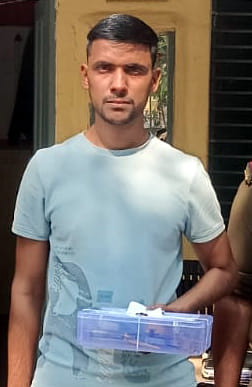 The accused who opened fire on the village head was arrested by the police.