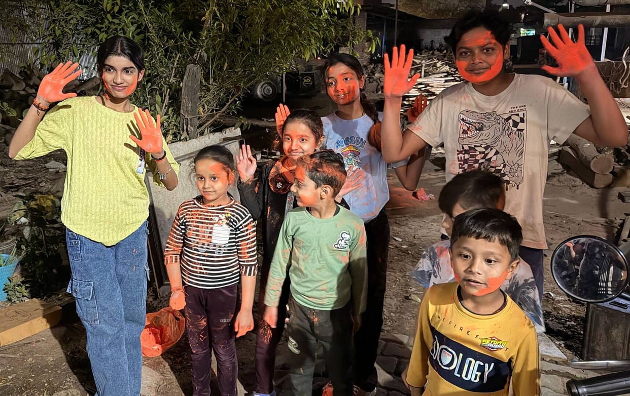 Childhood fun in the streets of Holi: drenched in colours