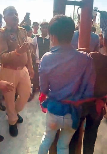 Two teenagers were tied to a pole and beaten in the temple premises on the charge of theft.