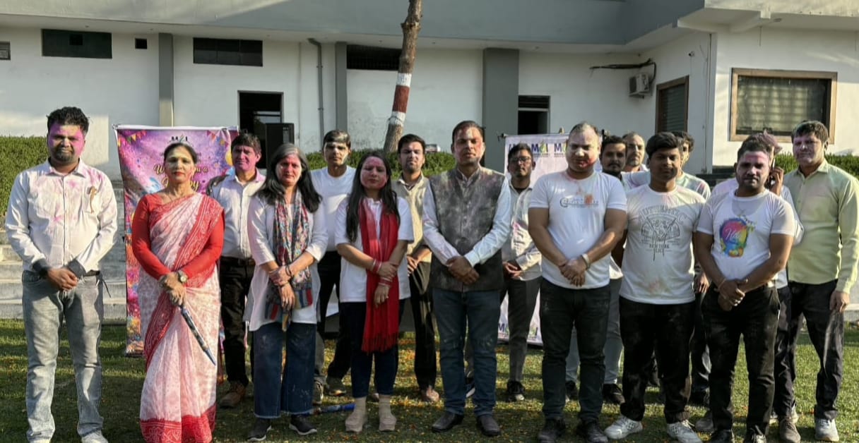 Wishing each other Happy Holi by applying gulal