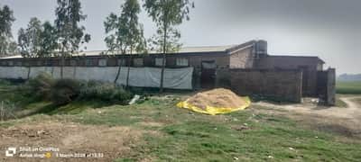 Liquor packaging racket in a closed poultry farm, two arrested including a gangster