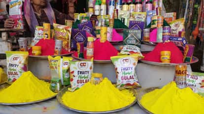 Crowds gathered at shops selling colours, clothes and sweets.