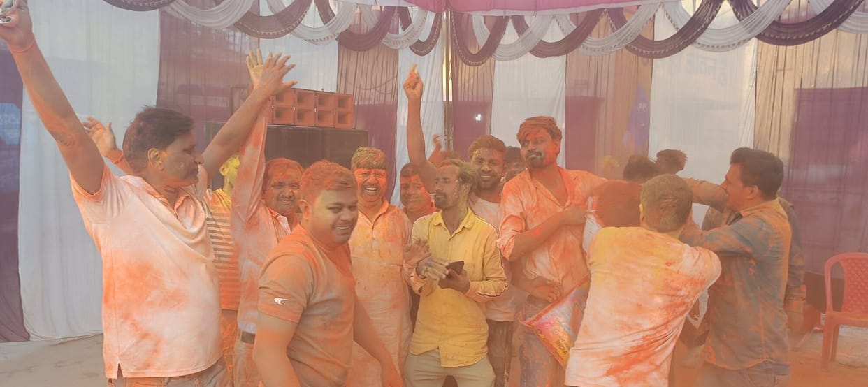 Abir and gulal were thrown at the Holi gathering.