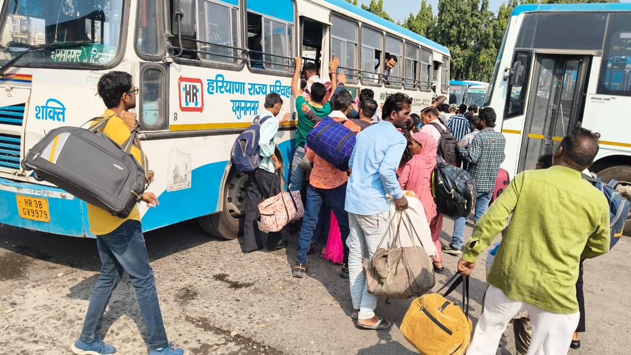 The rush to return home has led to a crowd at the bus station