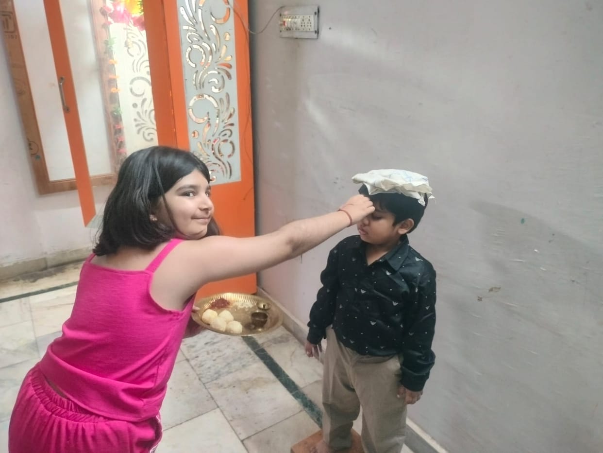 Sisters applied tilak to their brother and wished him a long life.