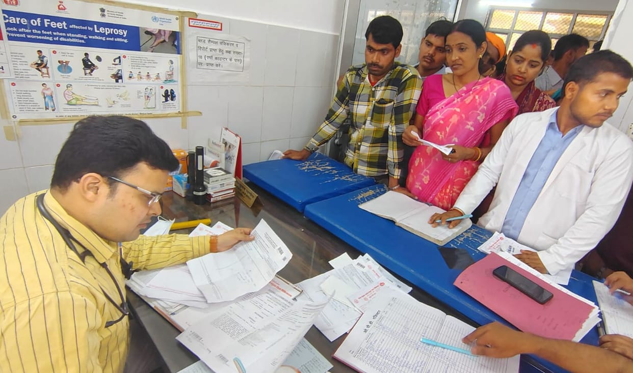 Patients queue up at the district hospital