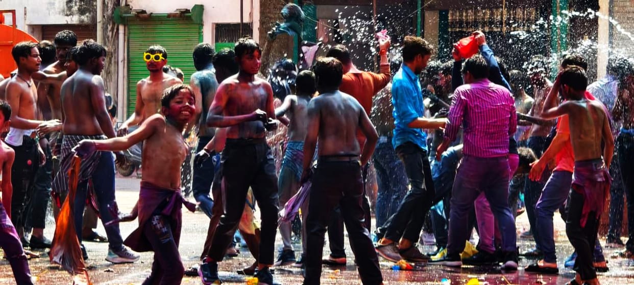 People danced to the beats of drums and DJ music...the district was drenched in colours.