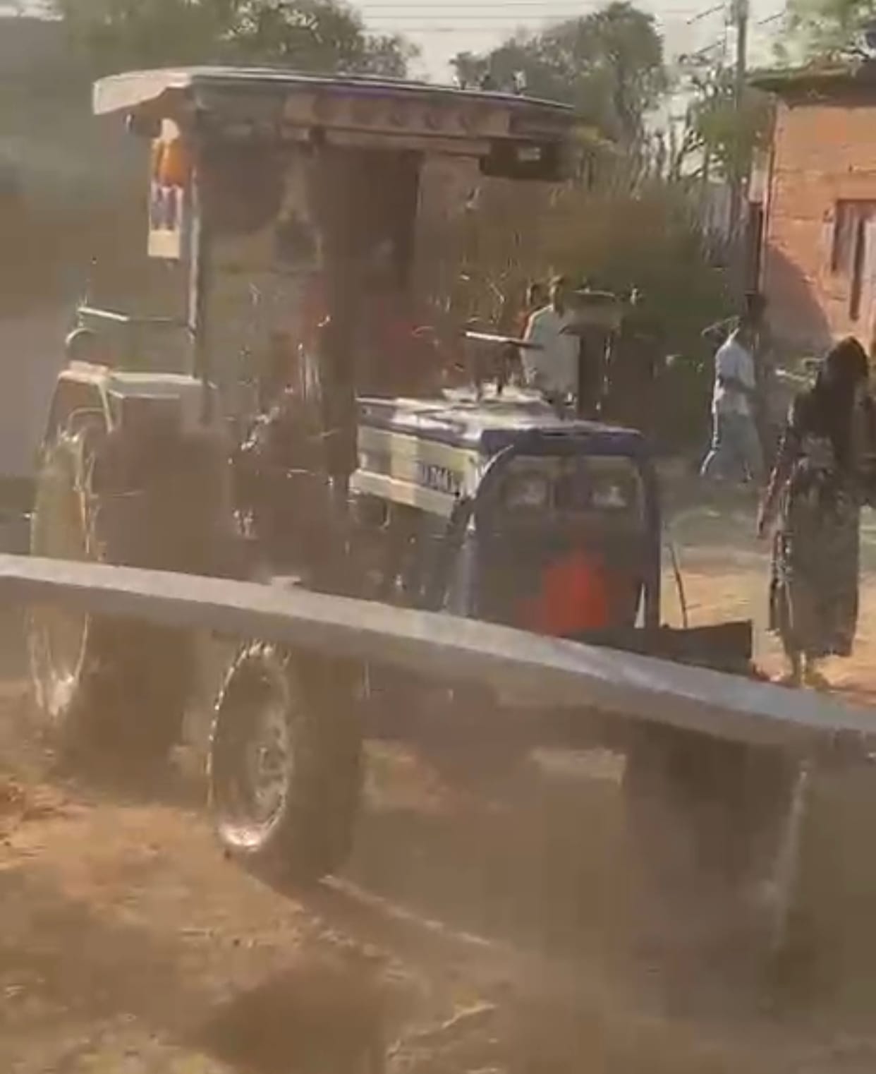 The young man broke the pole with a tractor