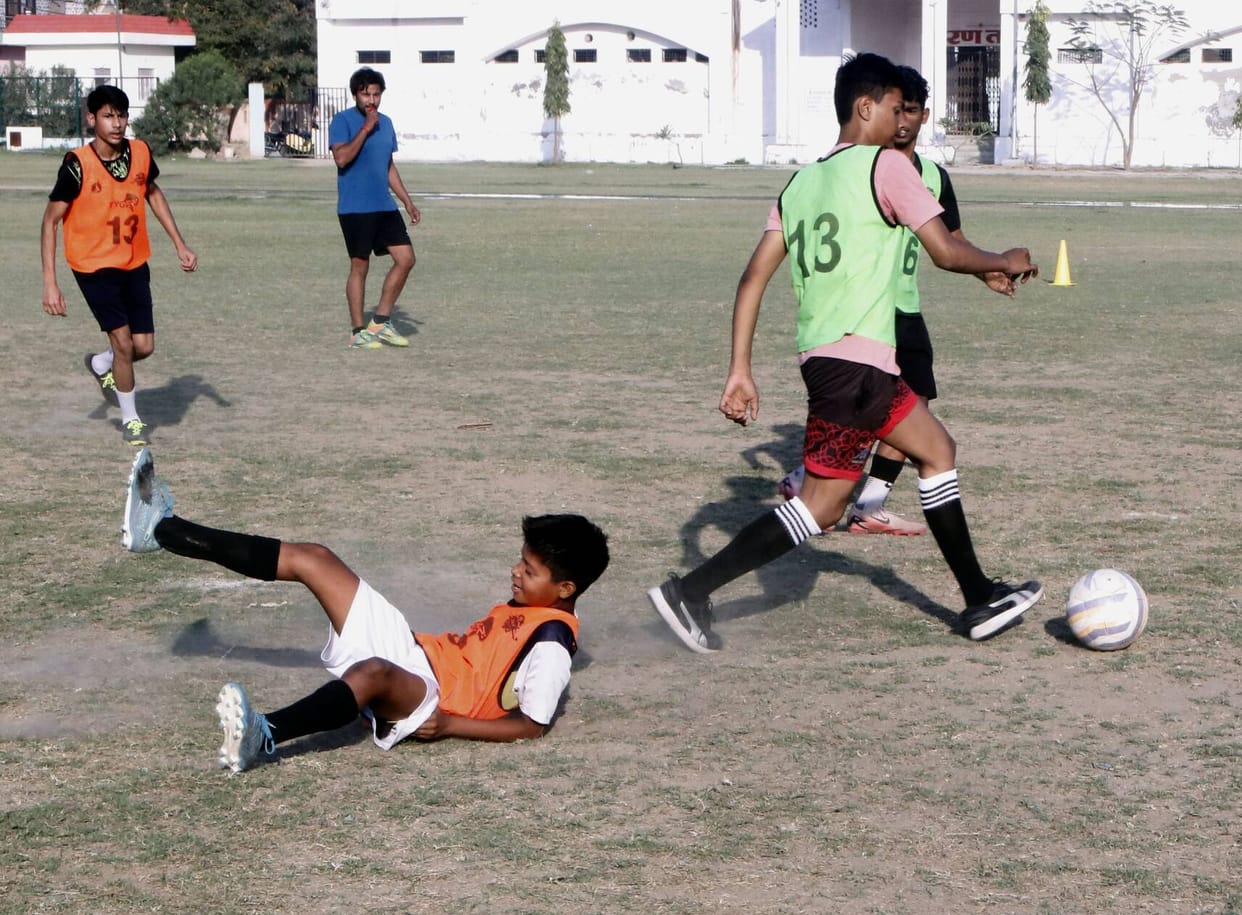Players sweated it out in the football trials.