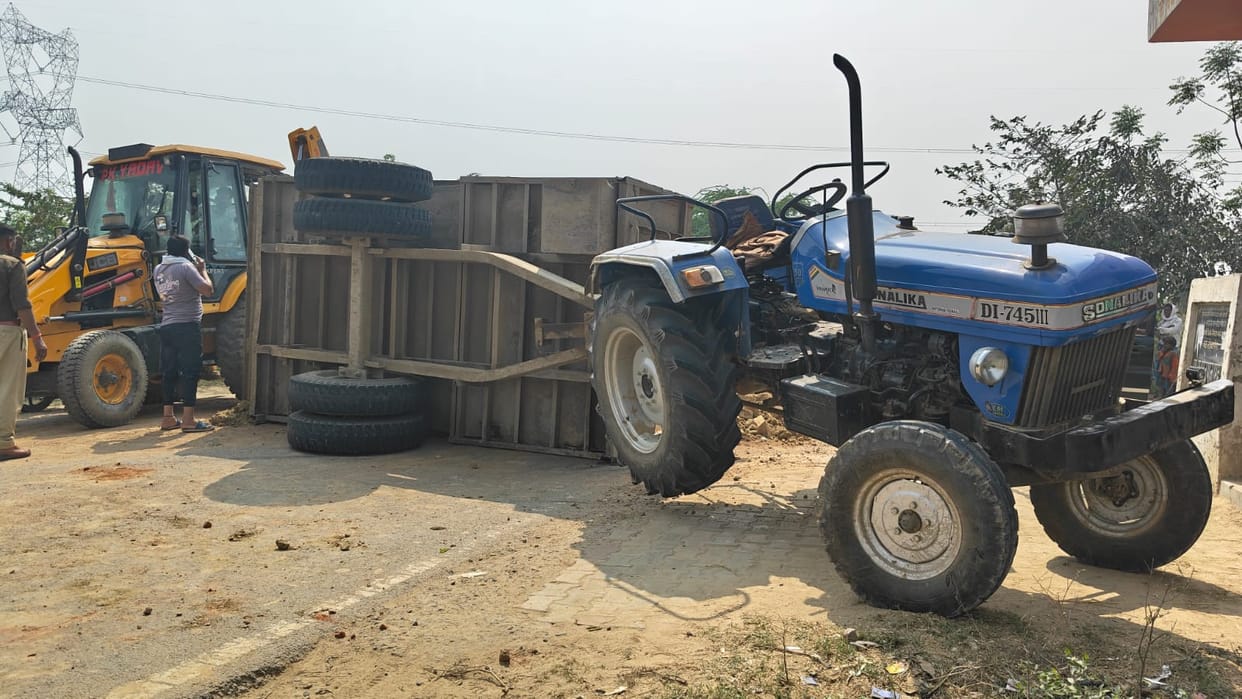 Mother and son riding a bike injured when tractor-trolley overturns