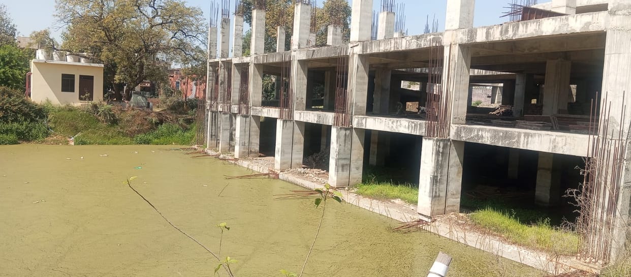 Construction of the hospital building is in limbo, sewer water is weakening the foundation.
