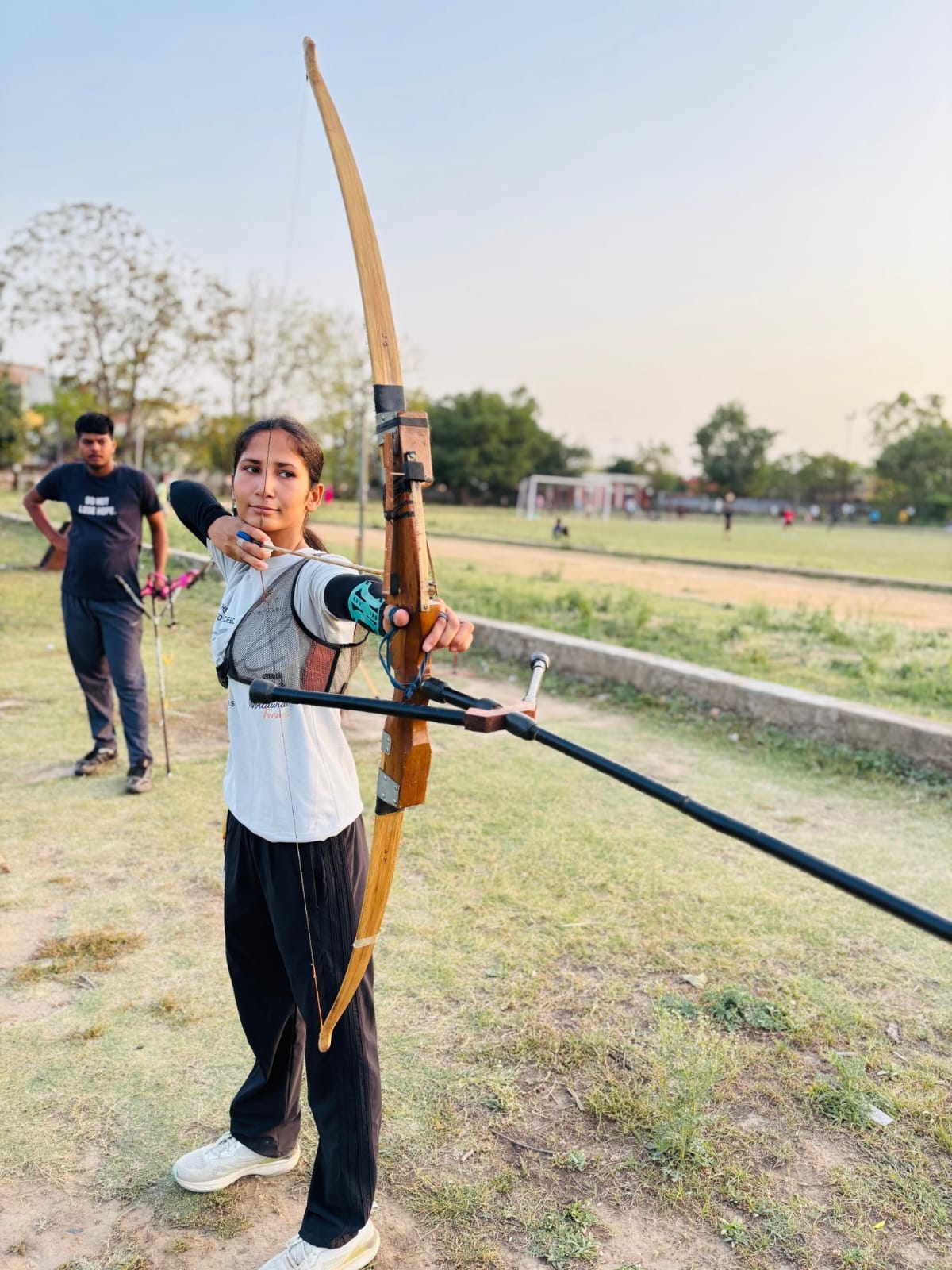 Bhavana is busy preparing for the national level archery competition.