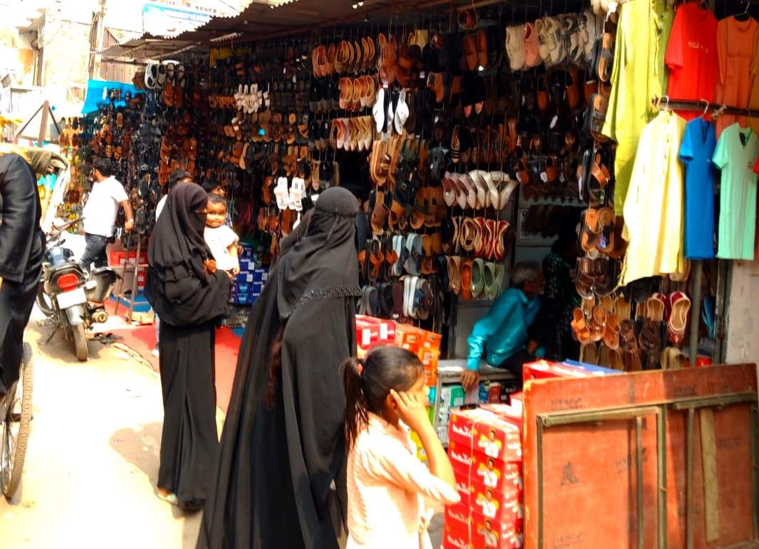 Shops selling Hyderabadi caps and shoes are set up in the Eid market.