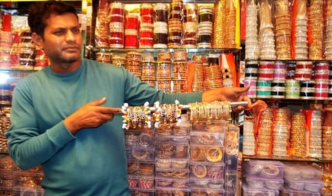 Kashmiri bangles with ghungroos and cowrie shells tinkling in the market
