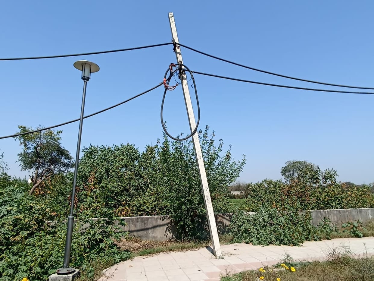 Electricity poles installed in the middle of the track