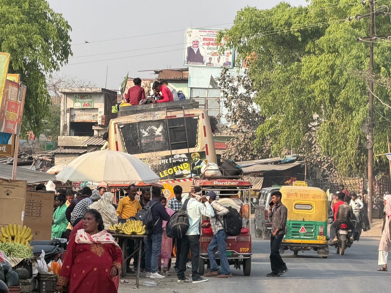 People risking their lives by traveling on the roofs of illegal buses
