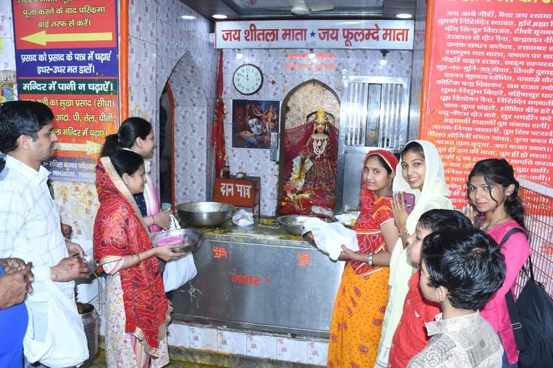 Devotees prayed by bowing their heads at Sheetla Mata Temple