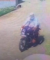 A masked man has been accused of attempting to kidnap a child.