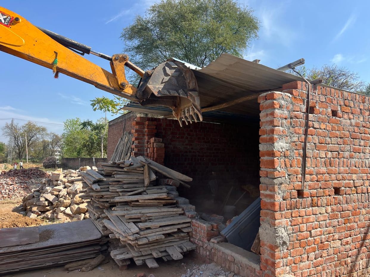 Bulldozers run on illegal construction on temple and Waqf Board land