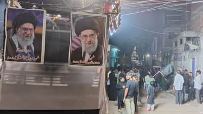 mourning procession commemorate martyrdom of hazrat Ali with picture of iranian supreme ayatollah khamenei