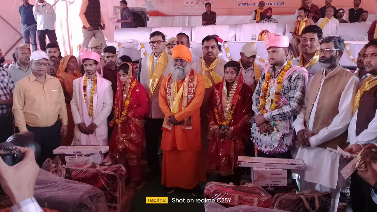 587 couples were united in the Mandi pavilion, chanting mantras and vows of marriage.
