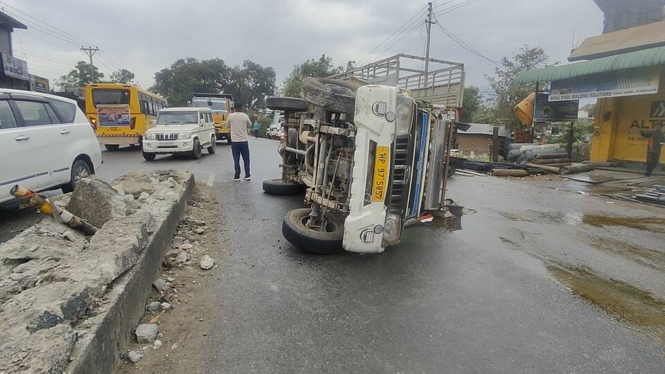 The pickup overturned after hitting the divider