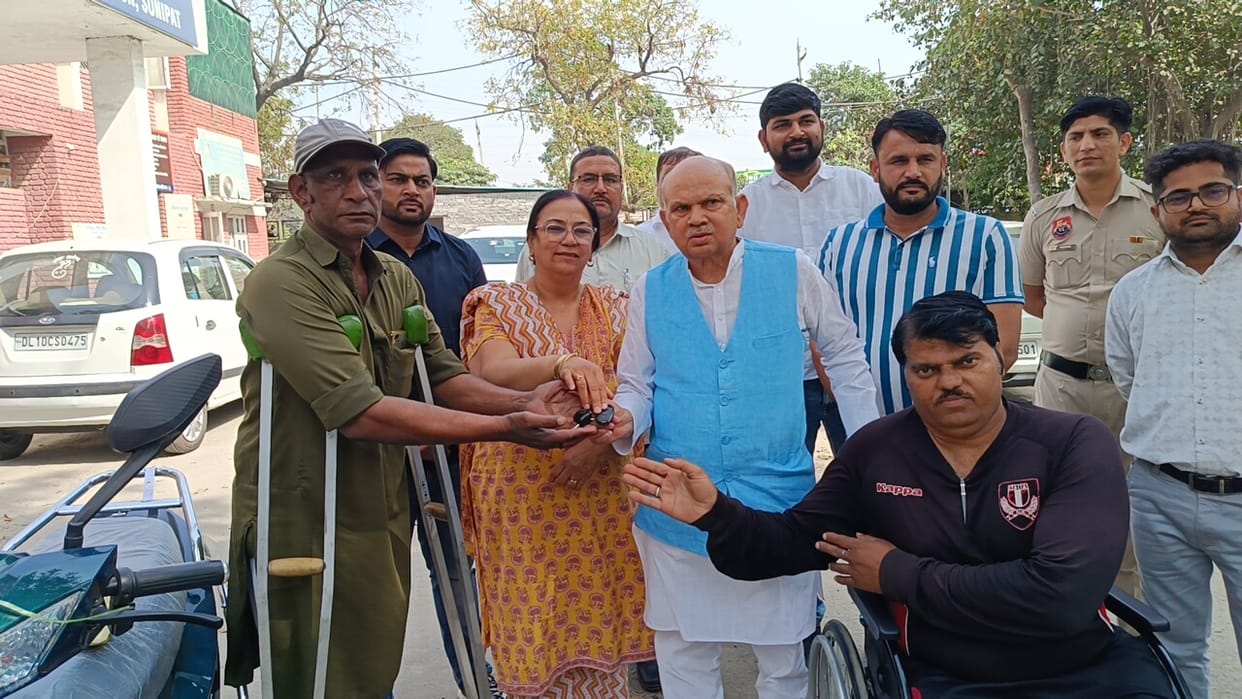 Two disabled persons got scooter and wheelchair from MP quota